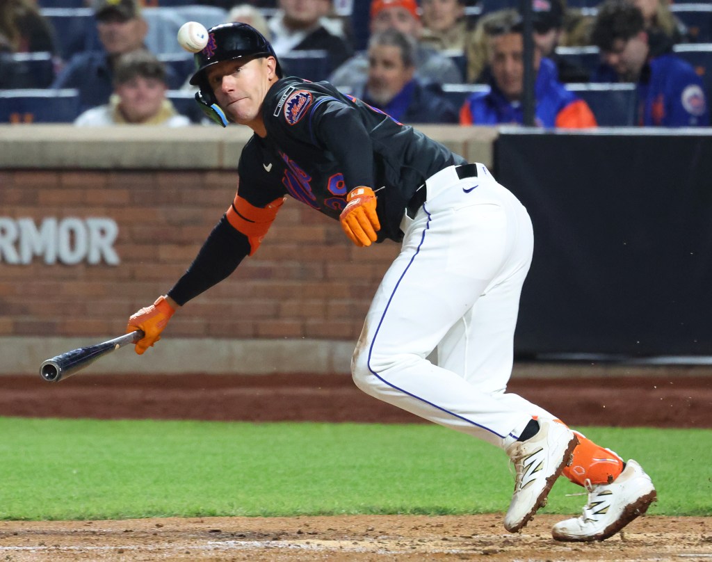 Jared Young bunts for a hit during the Mets' loss to the A's on April 10, 2026 at Citi Field. 