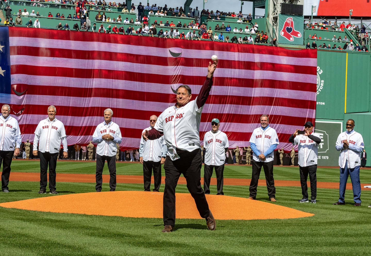 Former Red Sox pitcher Bruce Hurst throws out the first pitch.