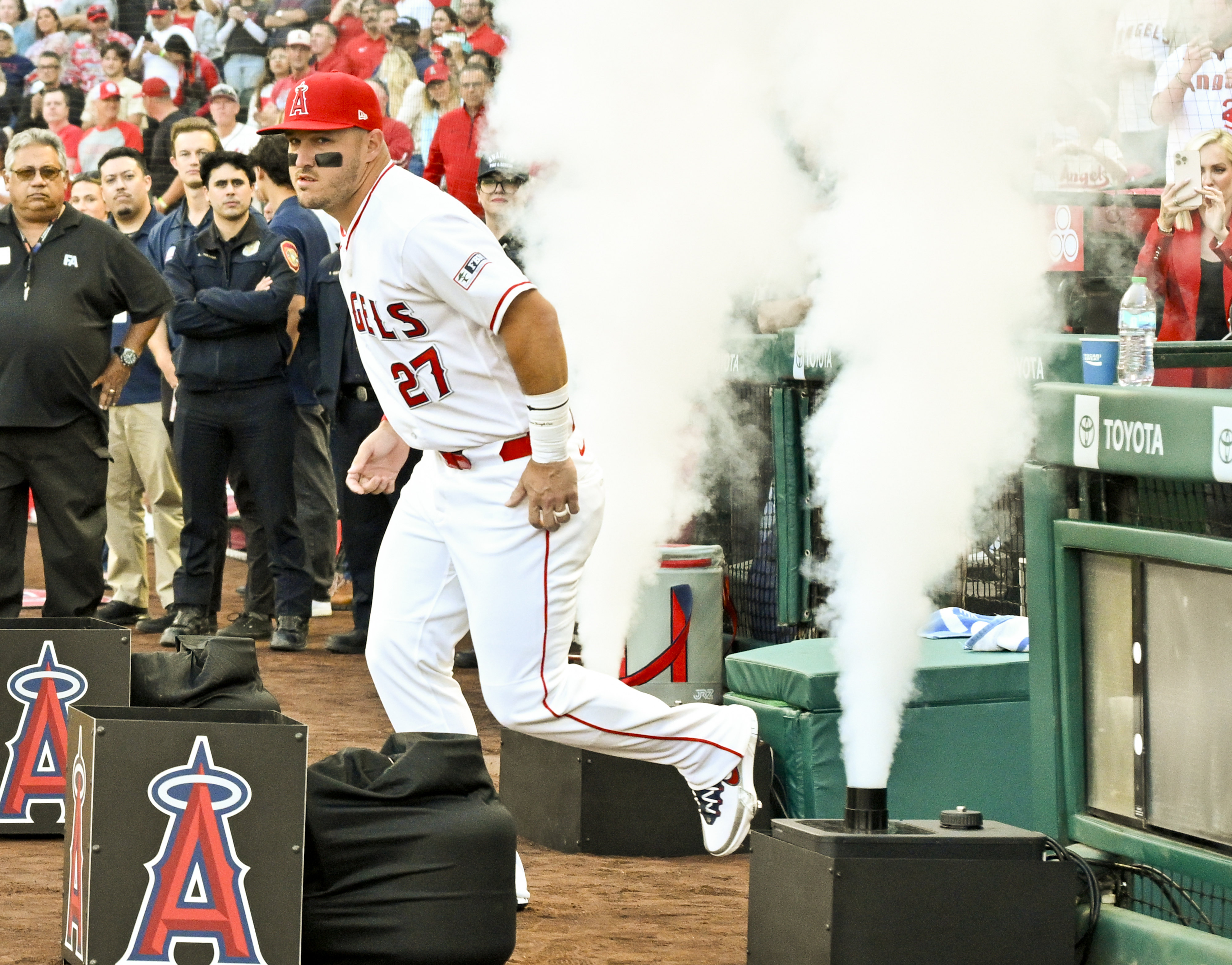 Angels star Mike Trout takes the field after being introduced...