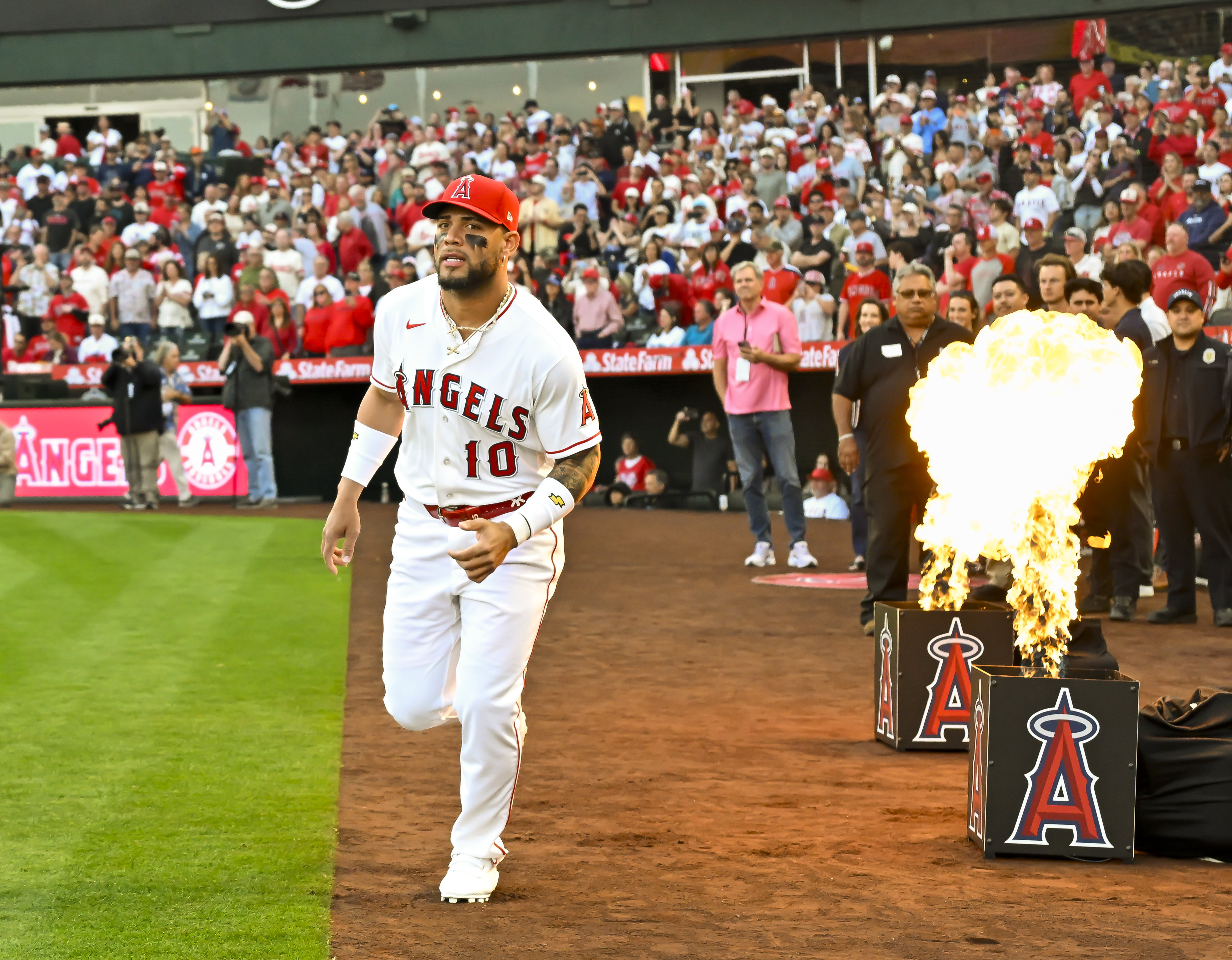 YoÃ¡n Moncada (10) of the Angels takes the field after...