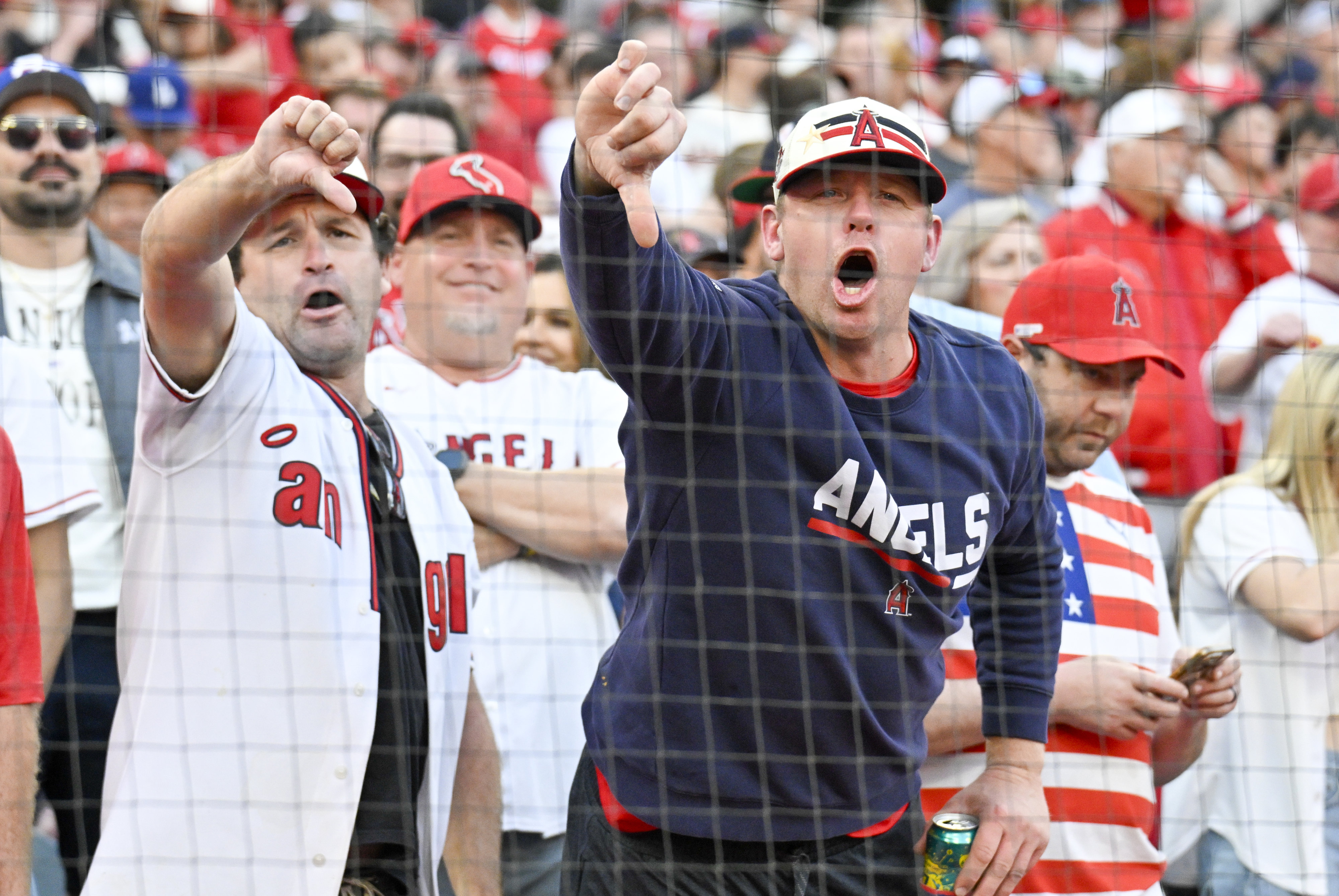 Angel fans boo departing team president John Carpino after throwing...