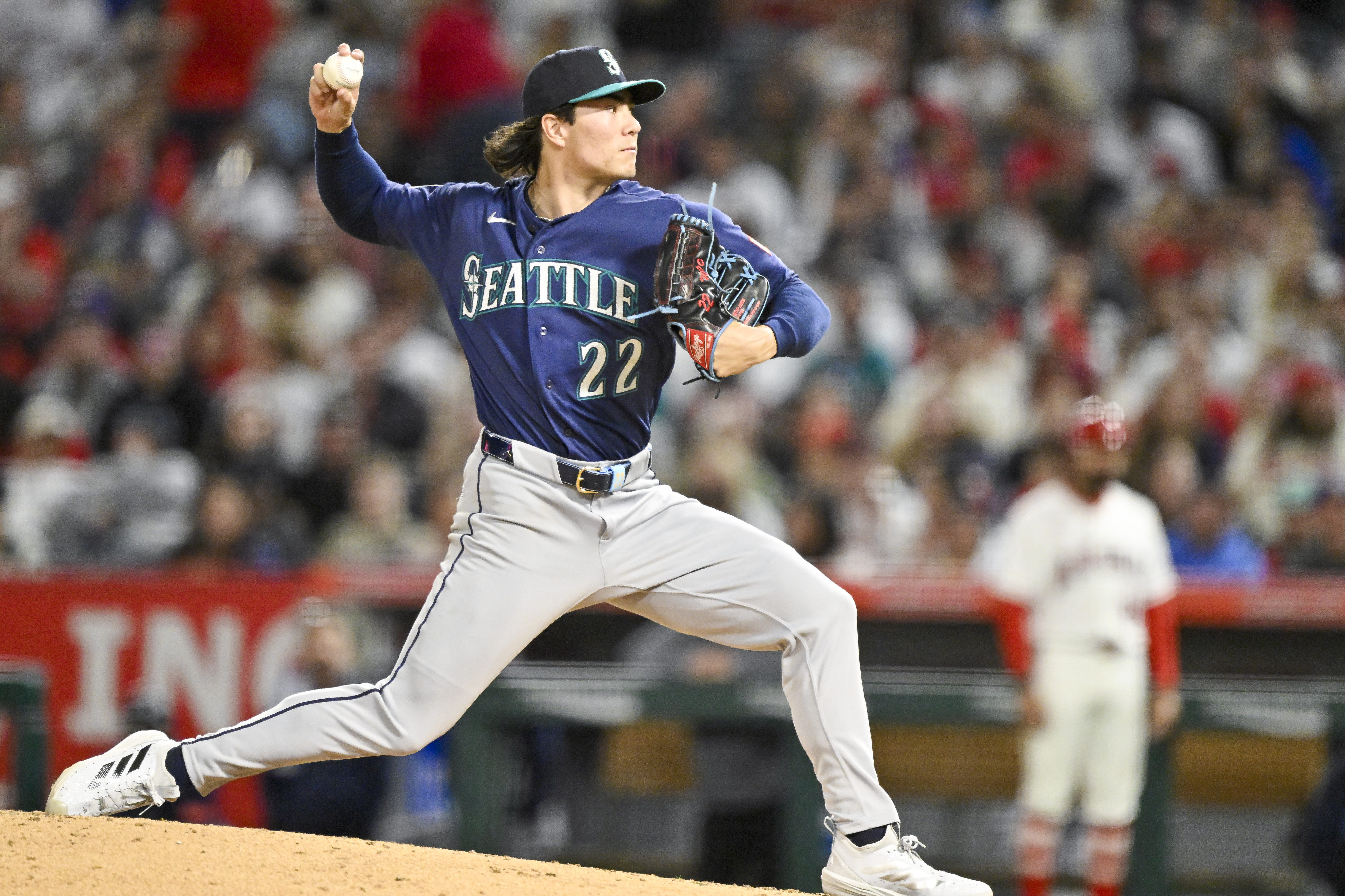 Seattle Mariners starting pitcher Bryan Woo throws to the plate...