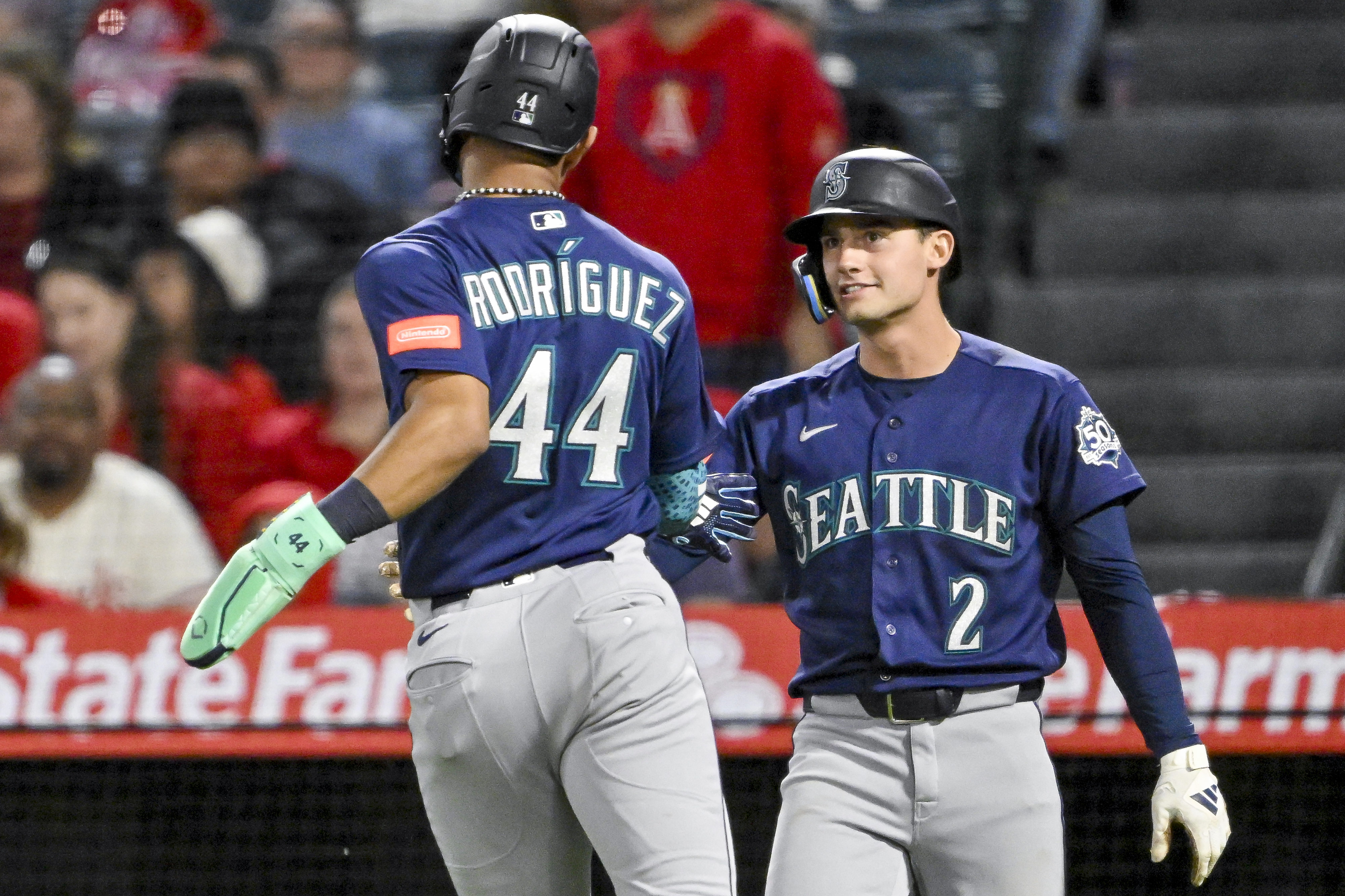 Julio Rodriguez (44), left, and Cole Young (2) of the...