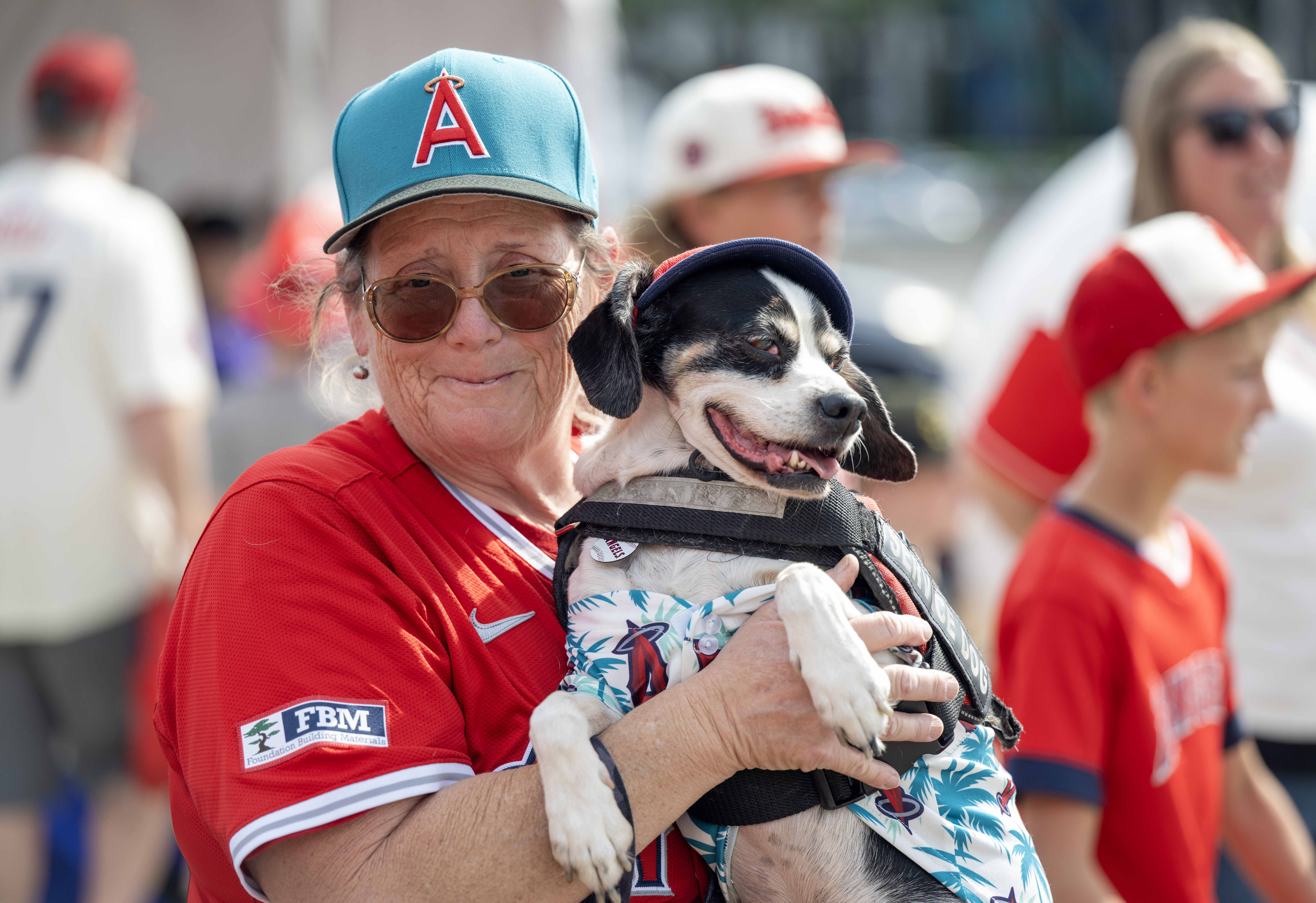 Amanda Taylor of Garden Grove holds her service dog, Zorro,...