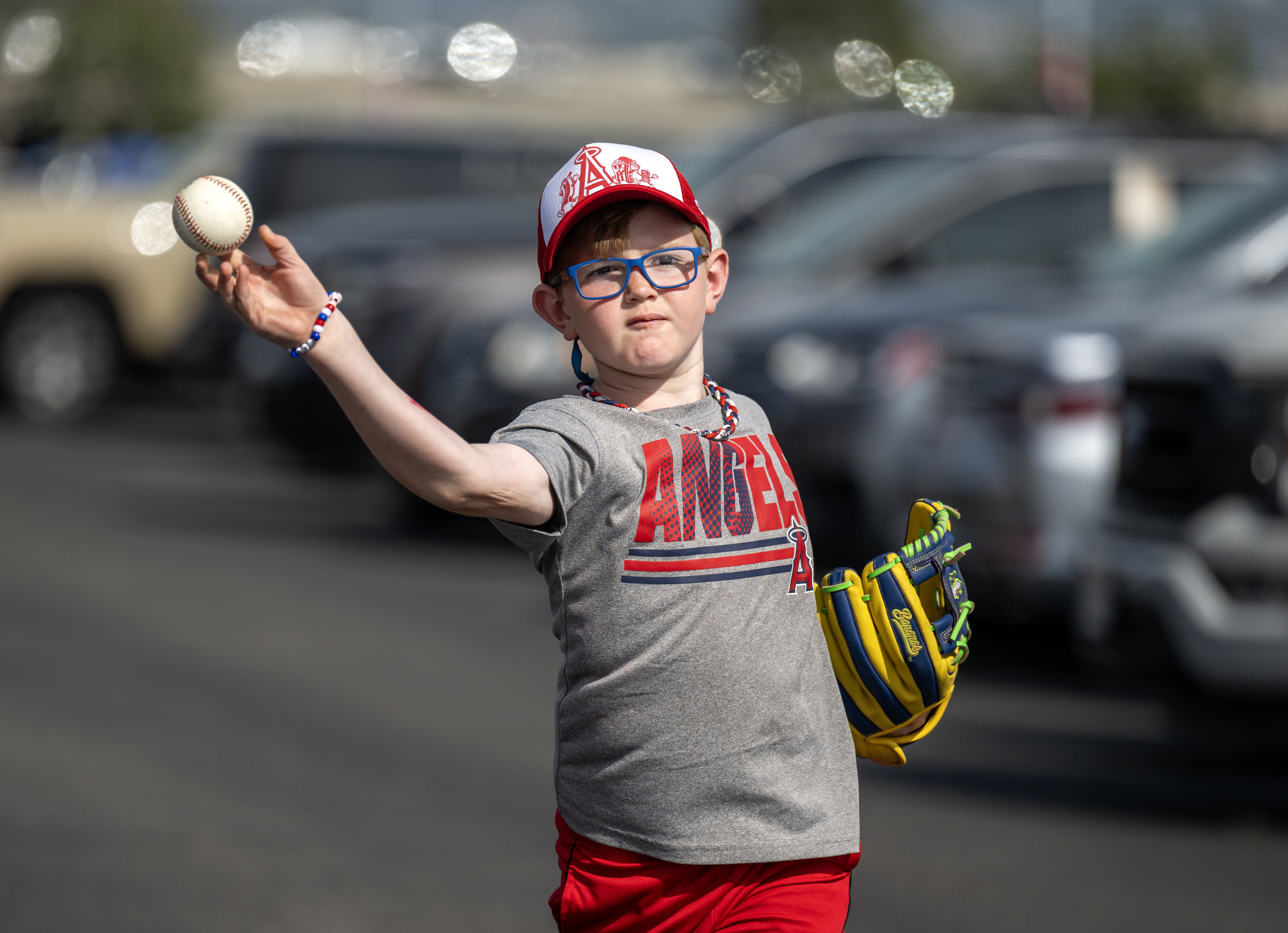 DJ Parkin, 8, of San Clemente plays catch with his...
