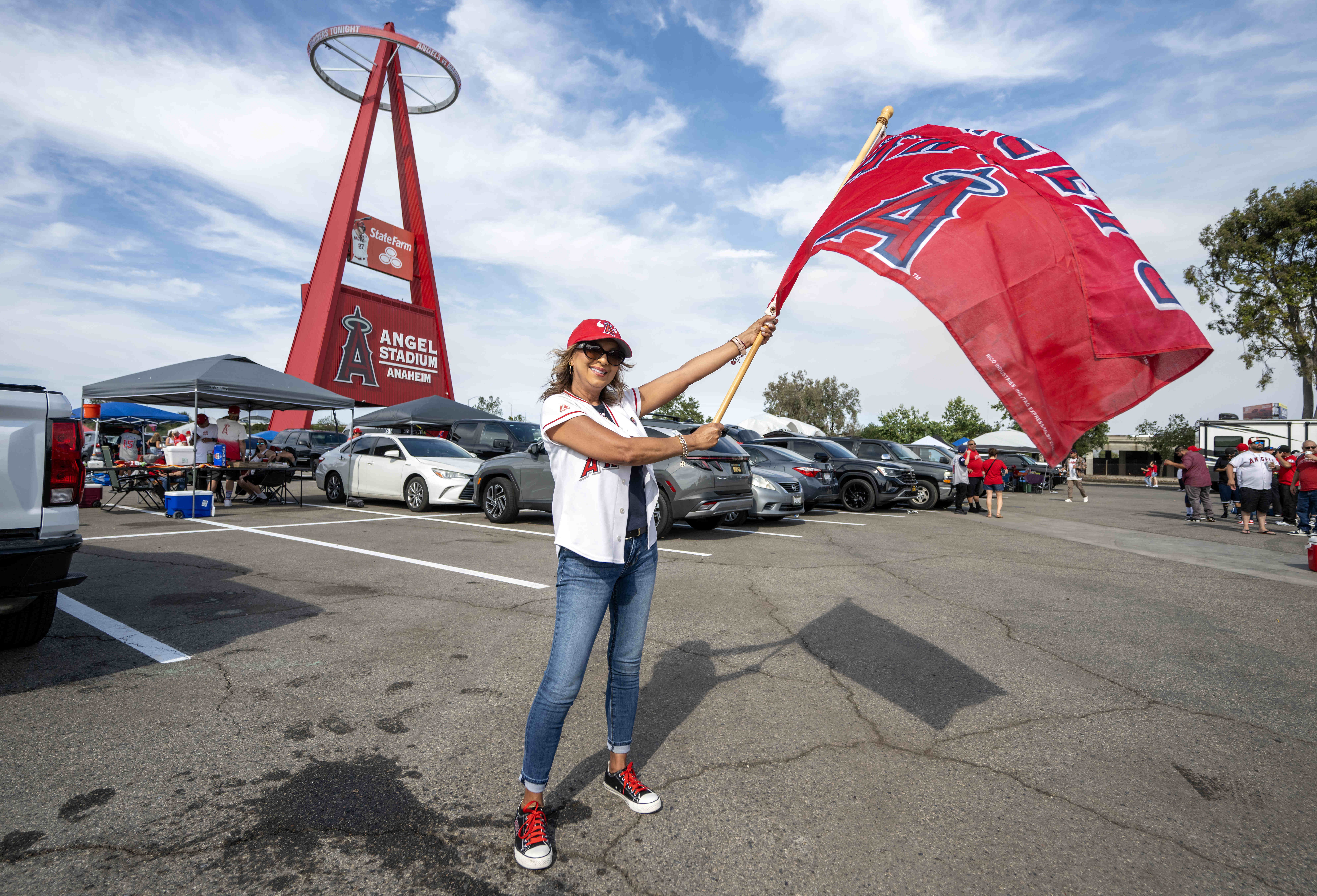 Clara Ferguson of San Clemente waves an Angels flag outside...