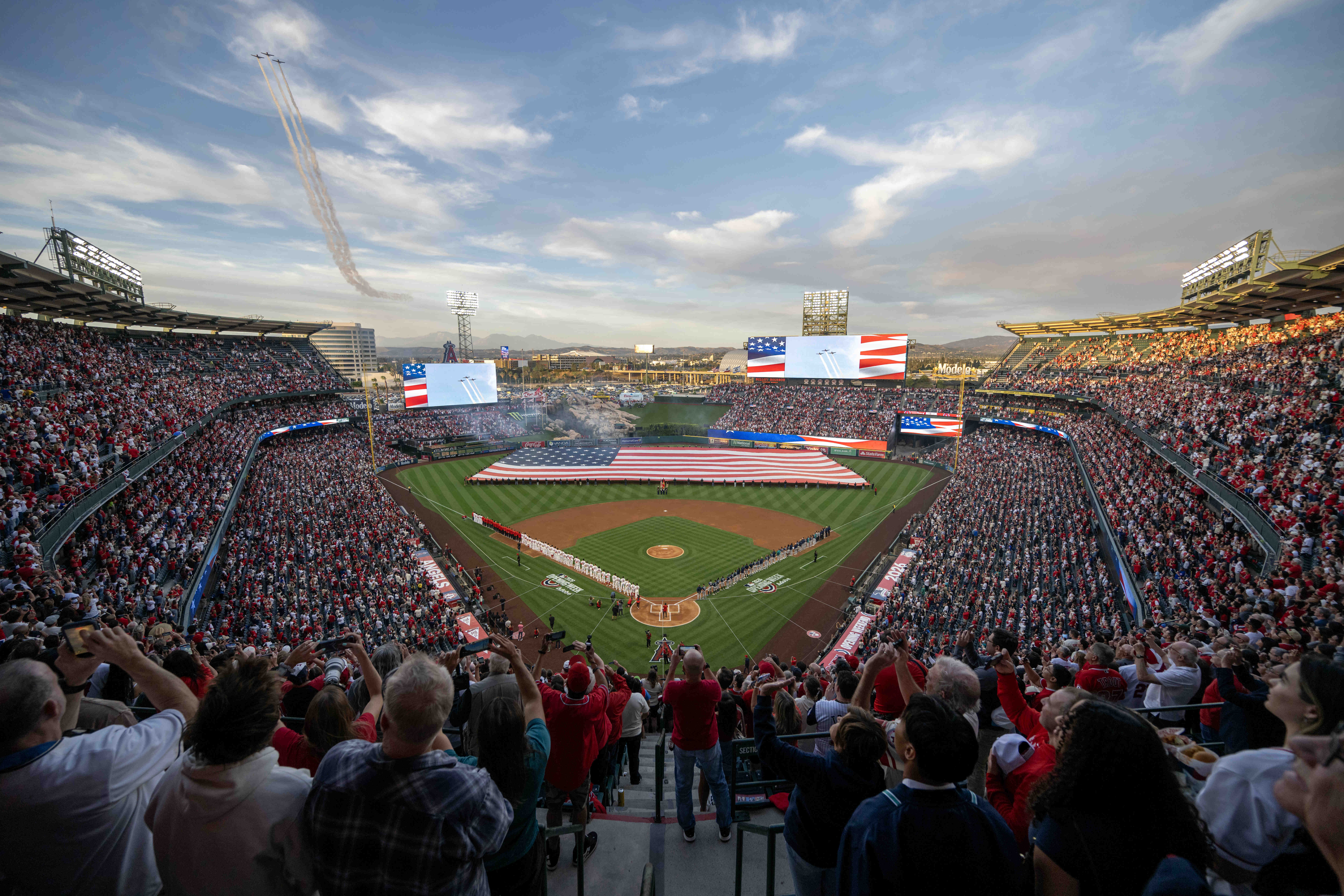 Planes fly over Angelsâ stadium during the National Anthem before...