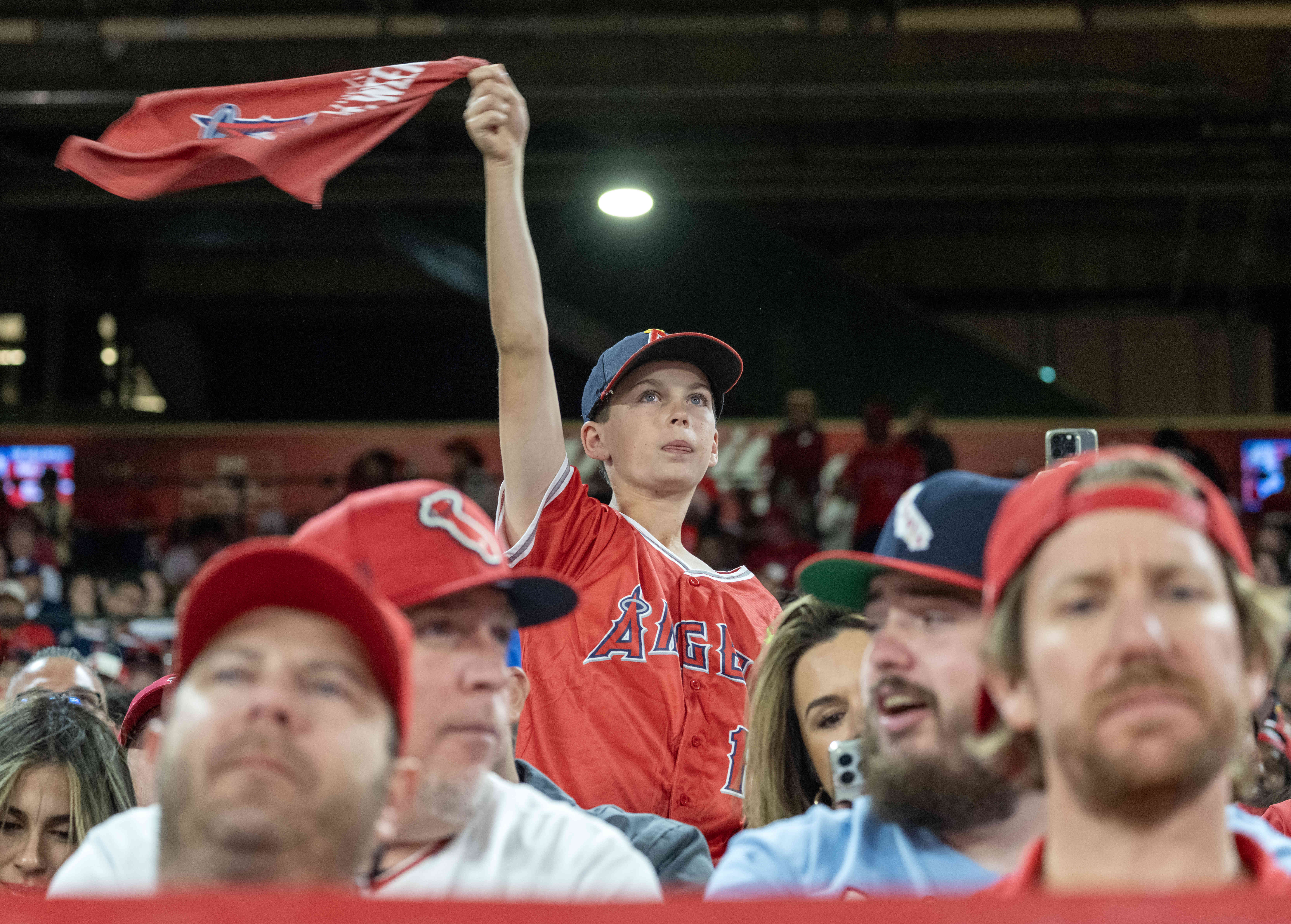 A young fan cheers on the Angels during their home...
