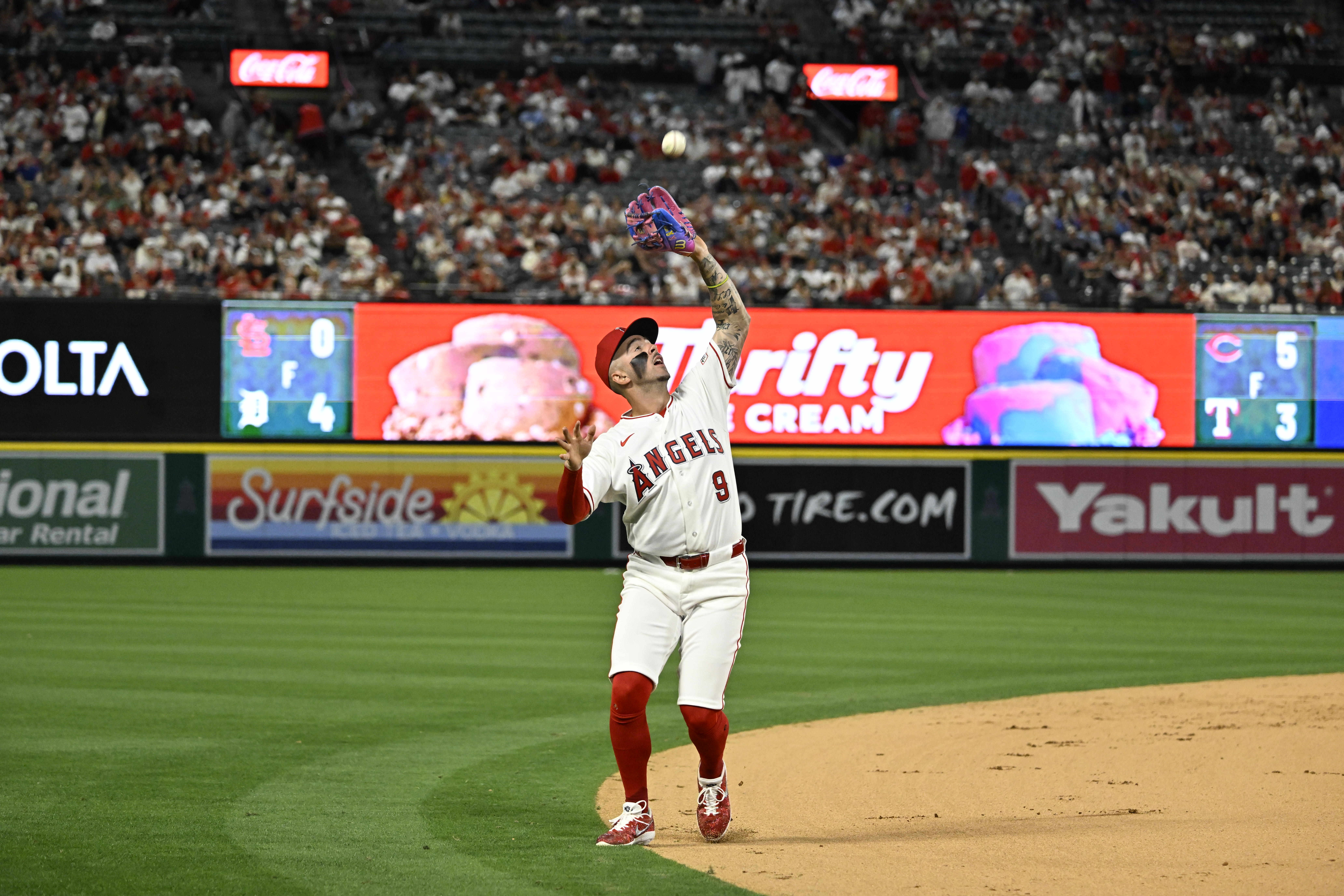 Angels shortstop Zach Neto catches a pop fly in the...