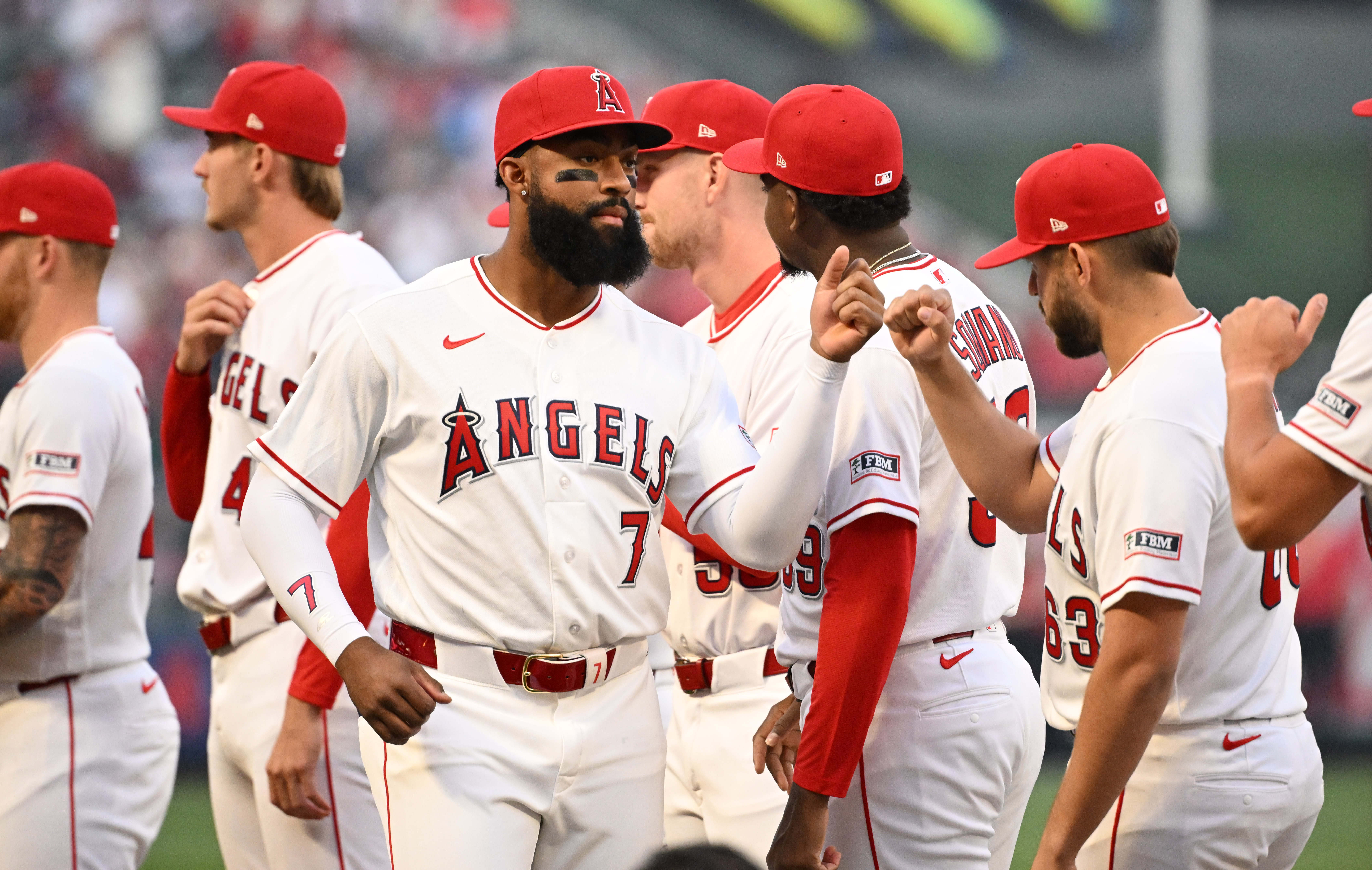Angels outfielder Jo Adell (7) greets teammates during pregame festivities...