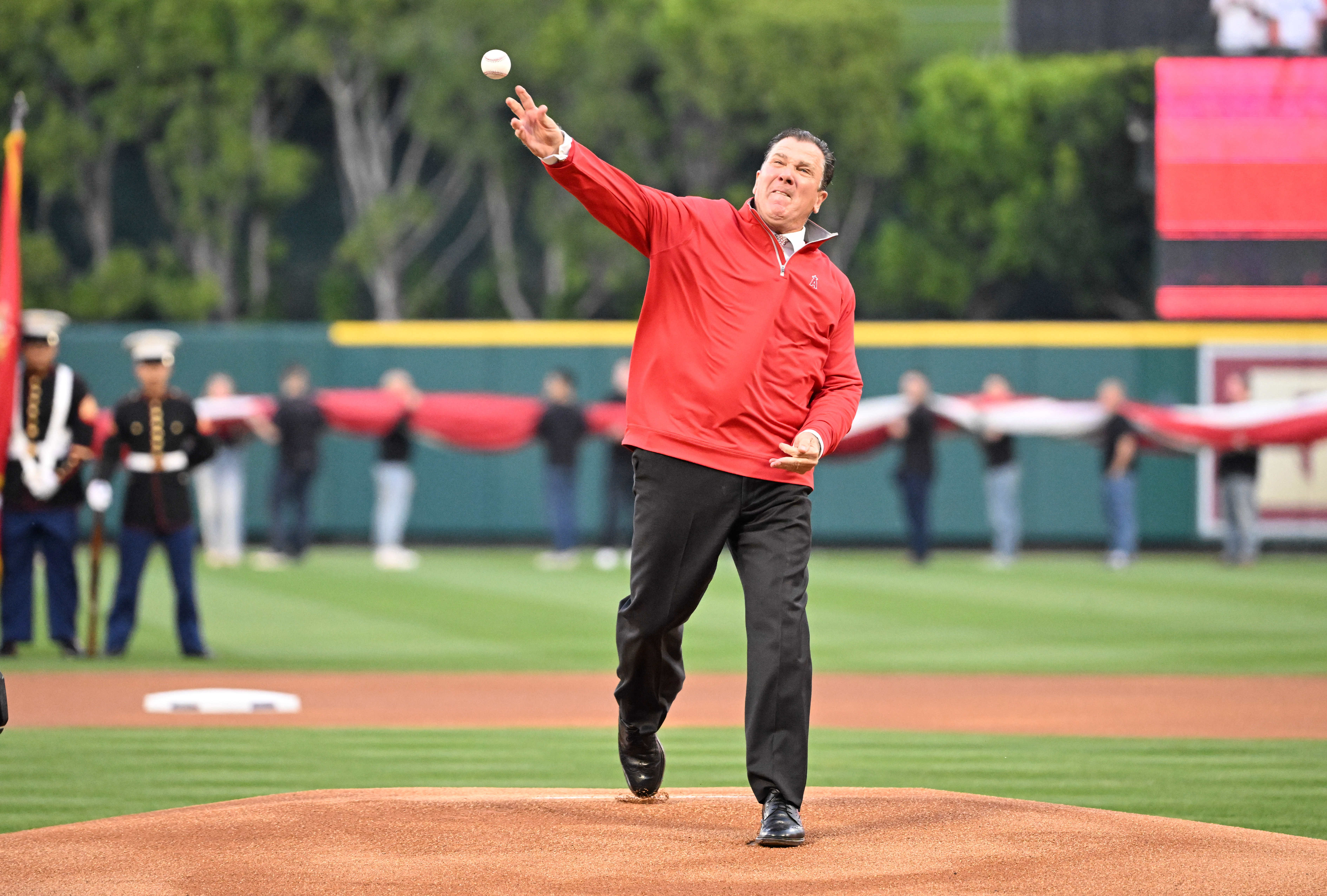 Outgoing Angels president John Carpino throws out a ceremonial first...