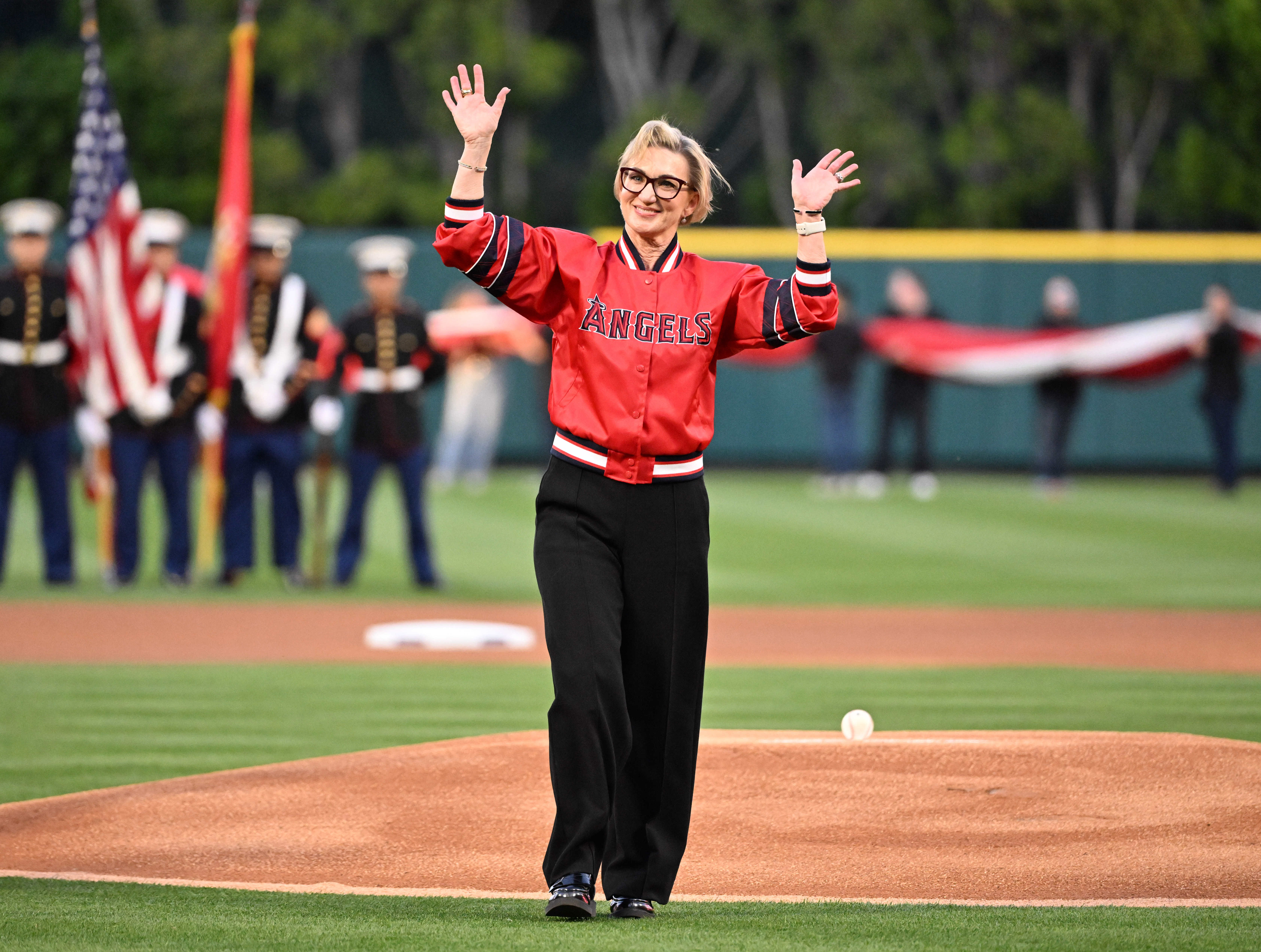 Angels Senior Vice President, Finance & Administration Molly Jolly waves...