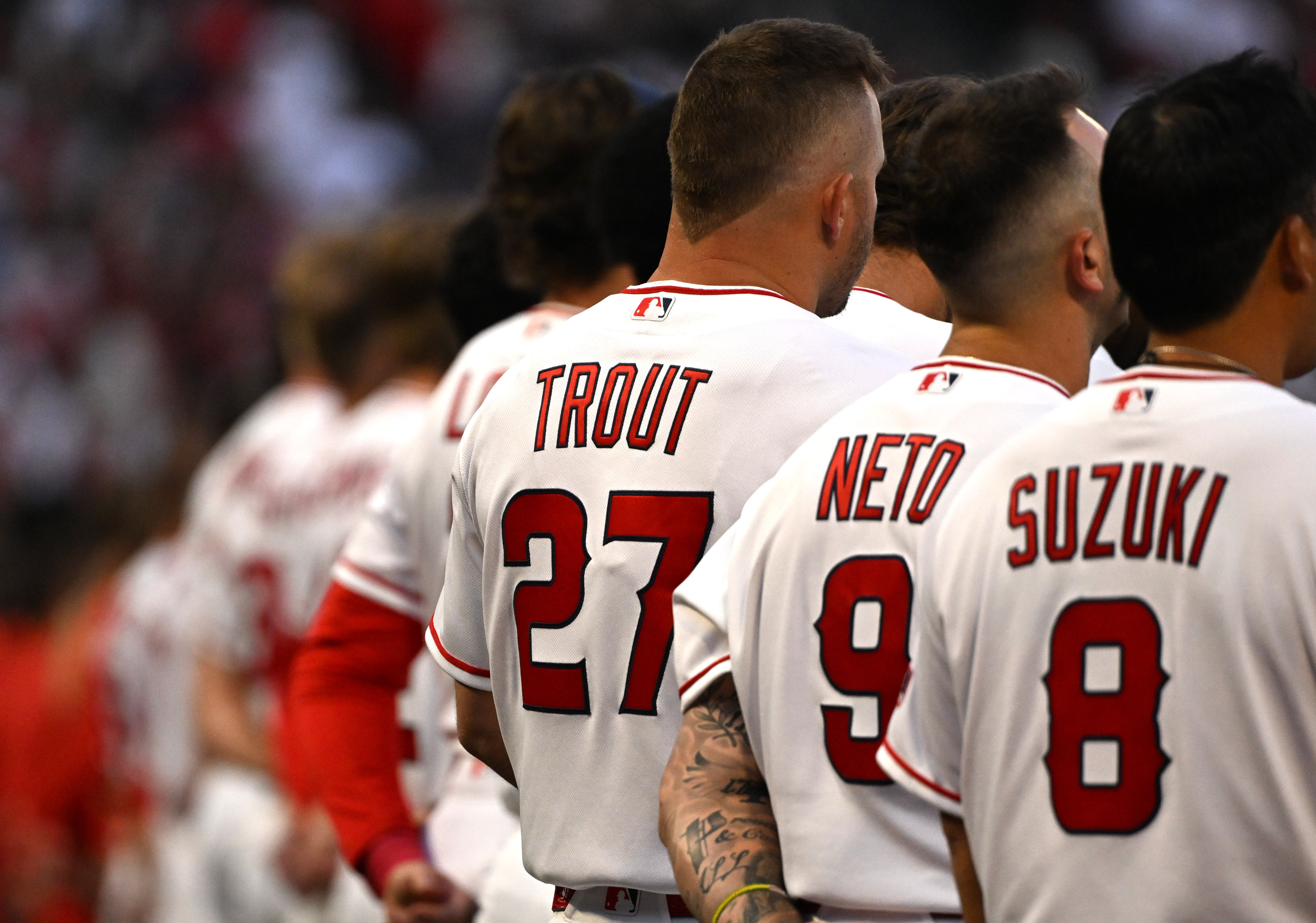 Angels star Mike Trout (27) stands on the third base...