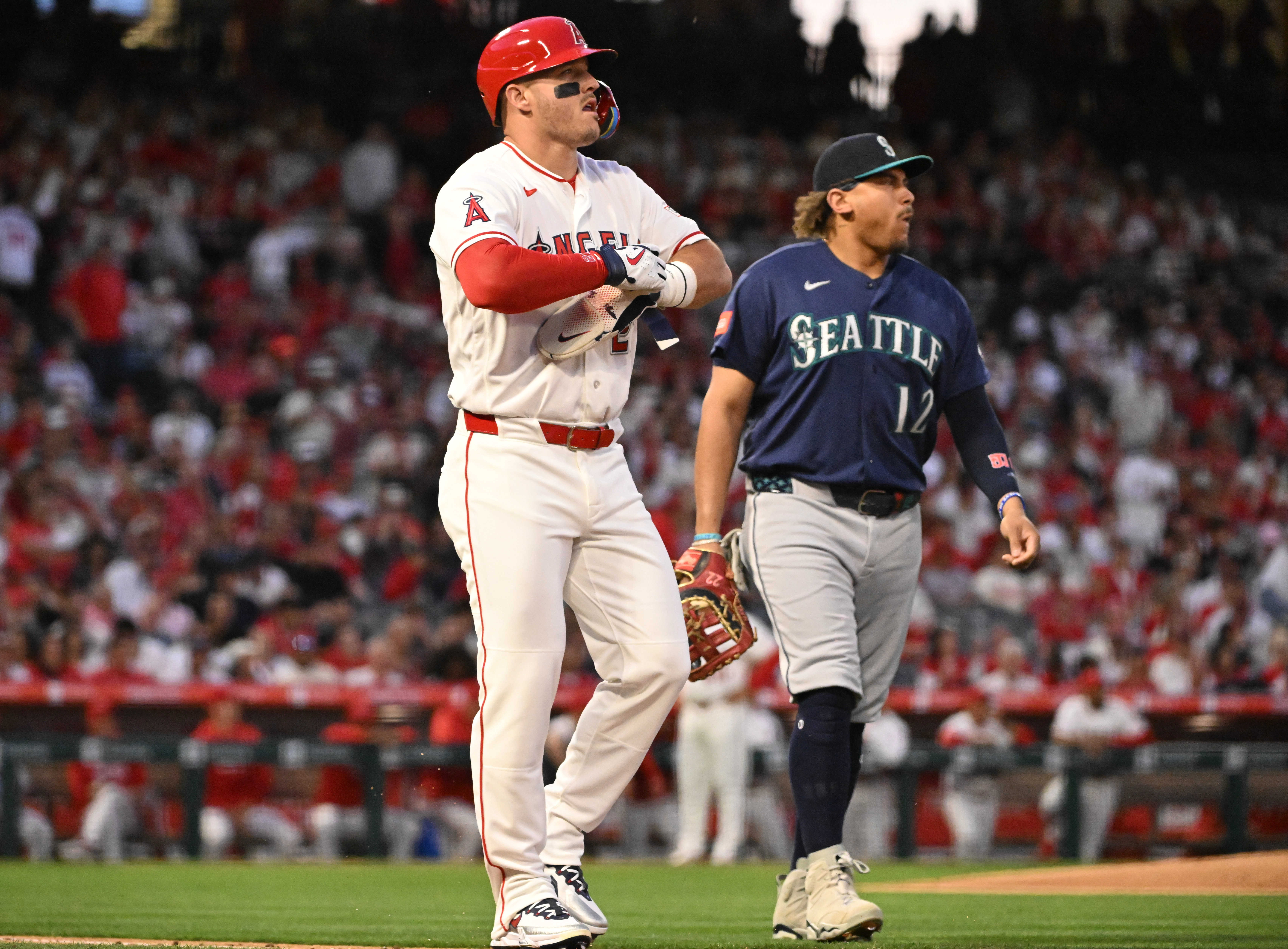 Mike Trout #27 of the Los Angeles Angels walks toward...