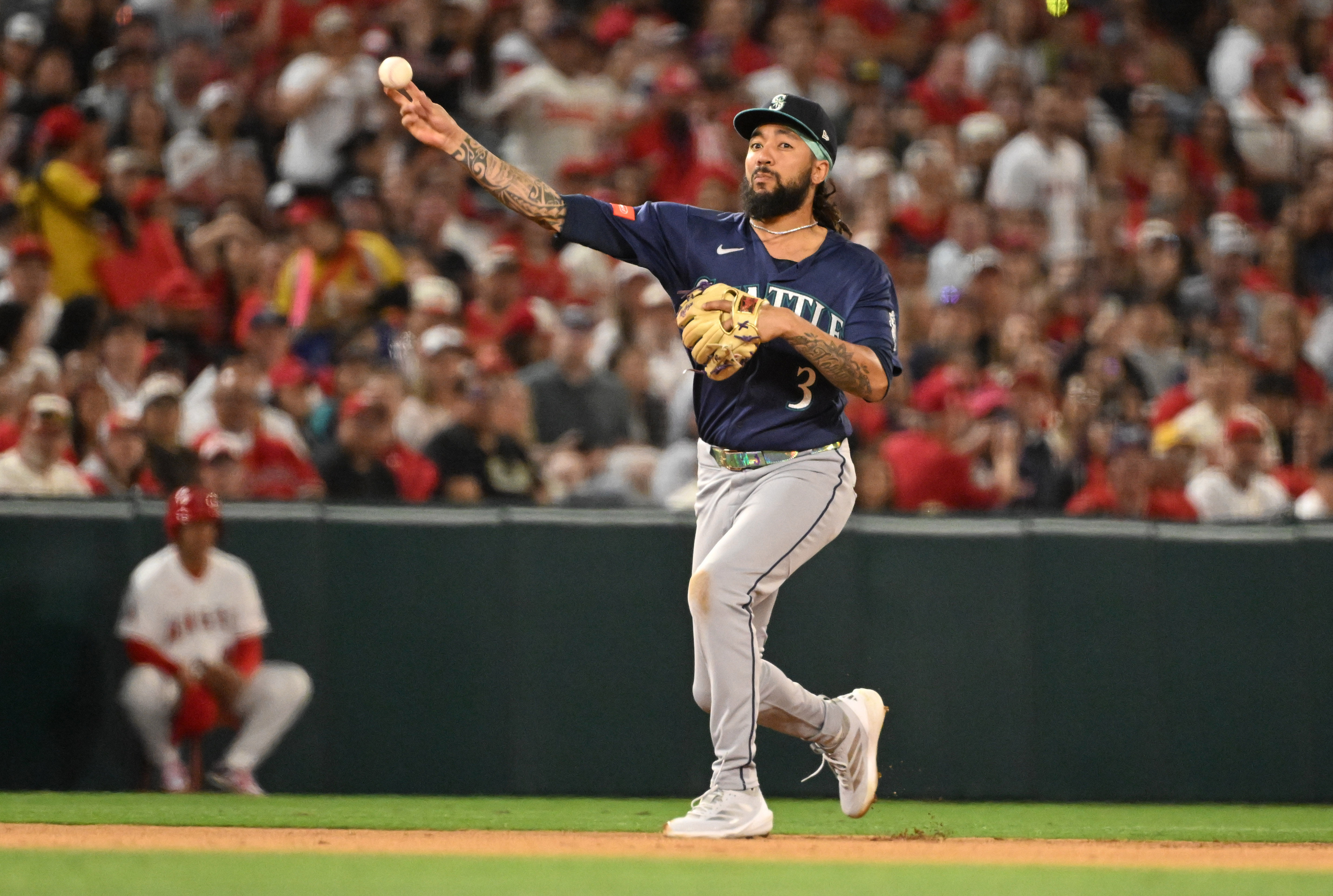 Shortstop J.P. Crawford #3 of the Seattle Mariners throws out...