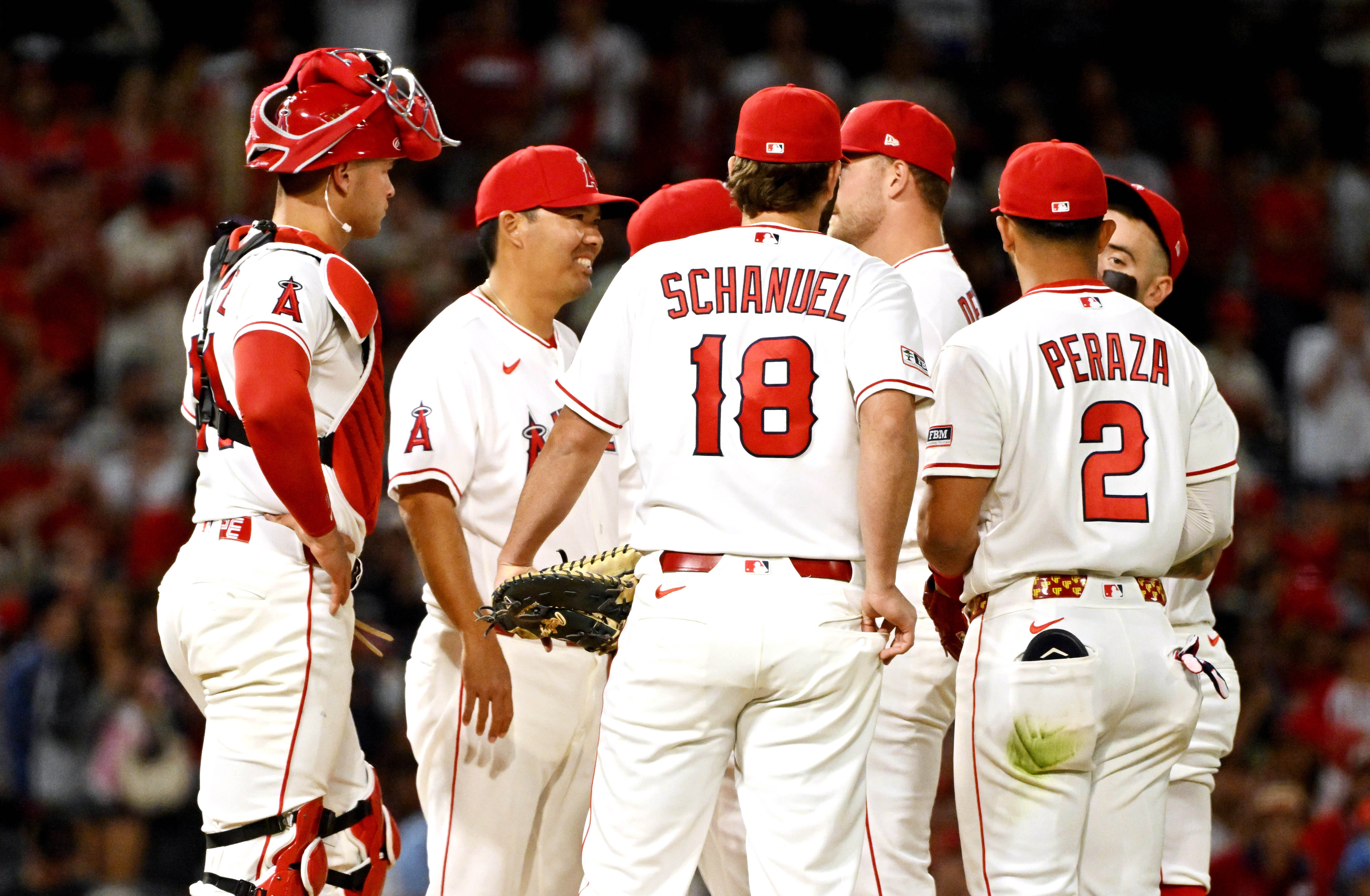 Manager Kurt Suzuki #8 of the Los Angeles Angels takes...