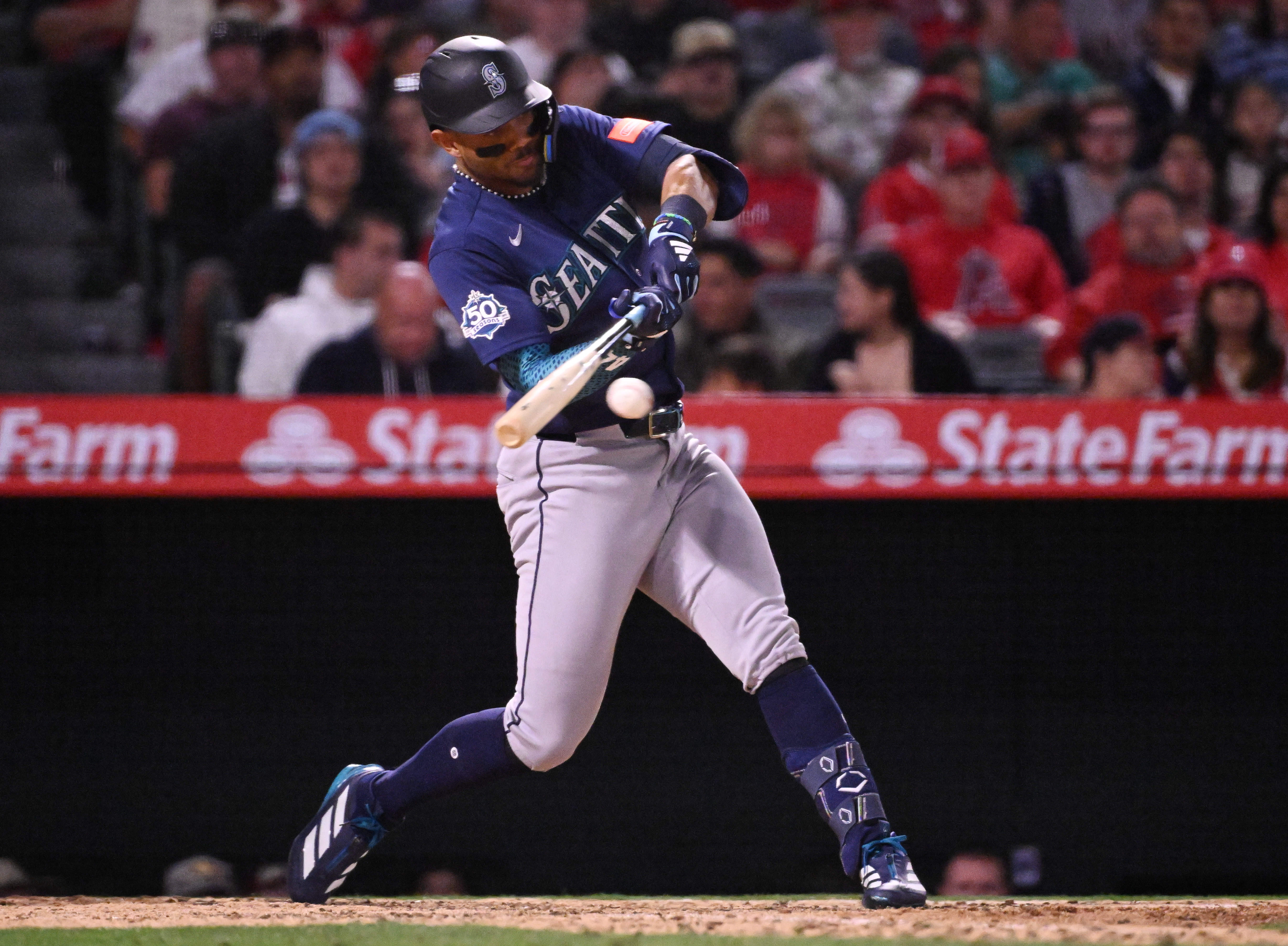 Julio RodrÃ­guez #44 of the Seattle Mariners singles against the...