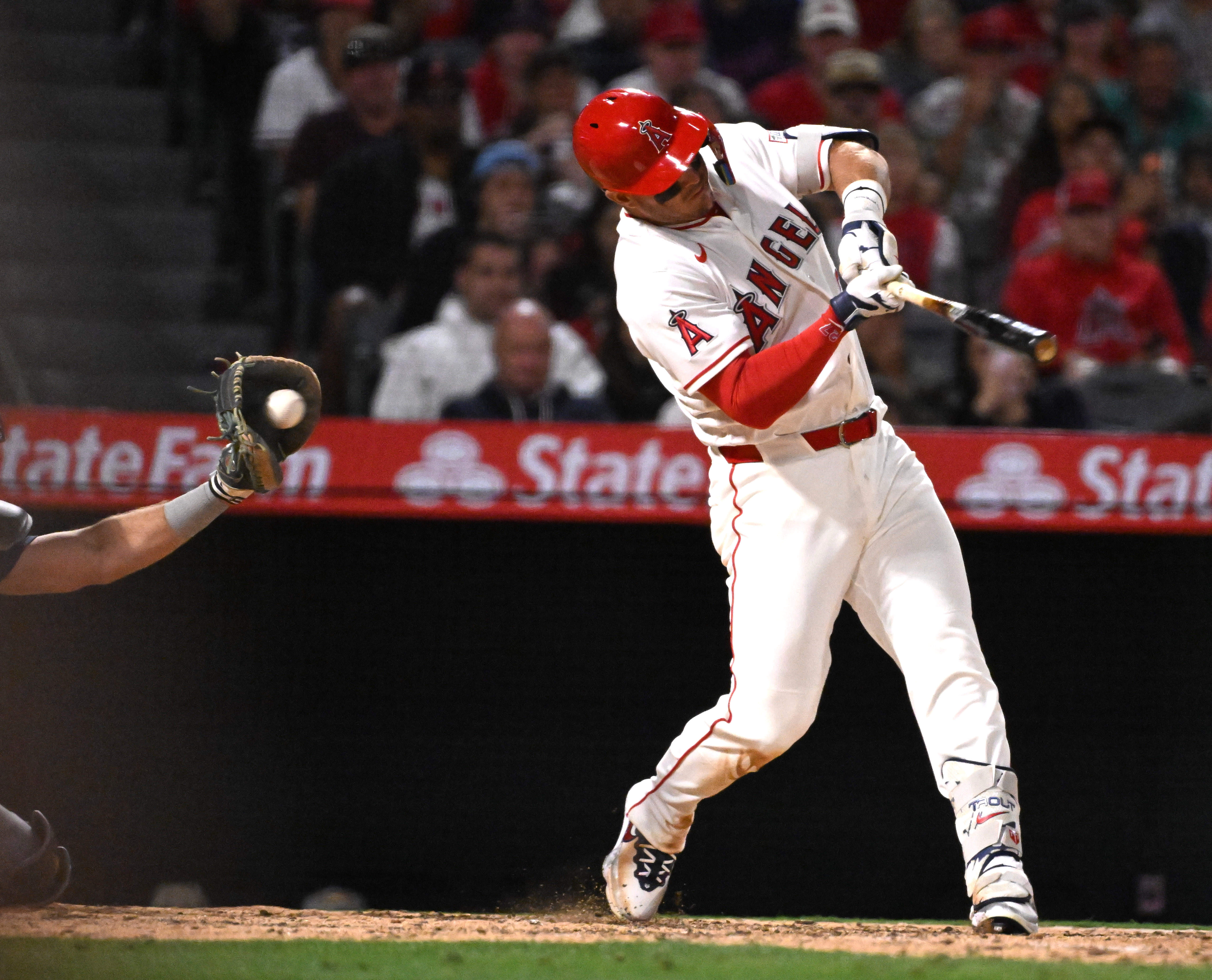 Mike Trout #27 of the Los Angeles Angels strikes out...