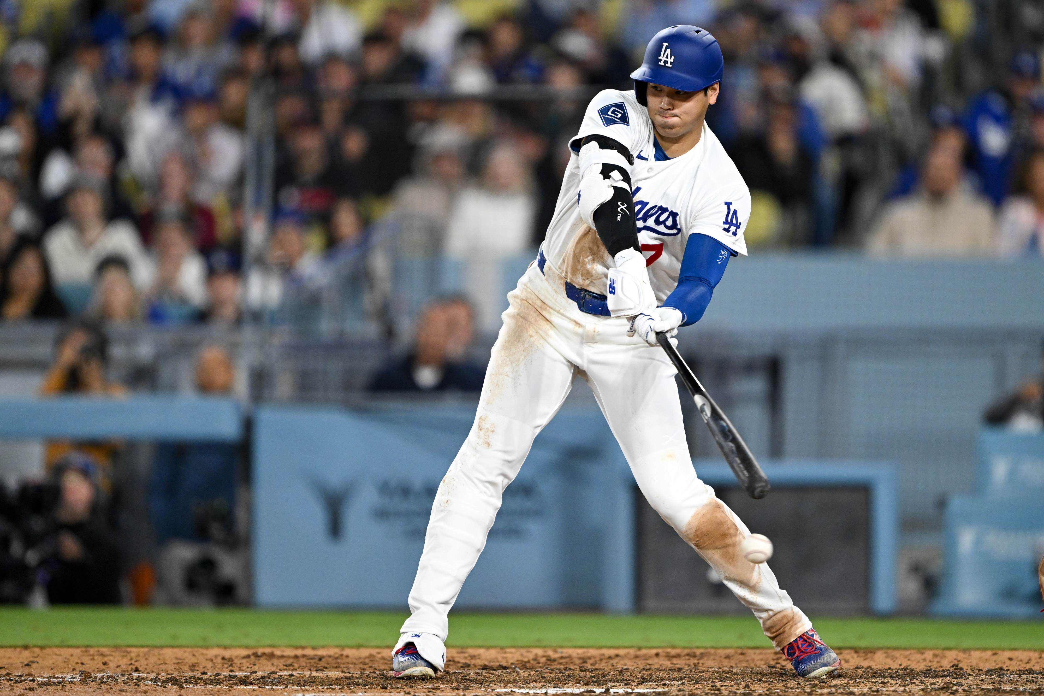 Dodgers star Shohei Ohtani strikes out swinging during the eighth...