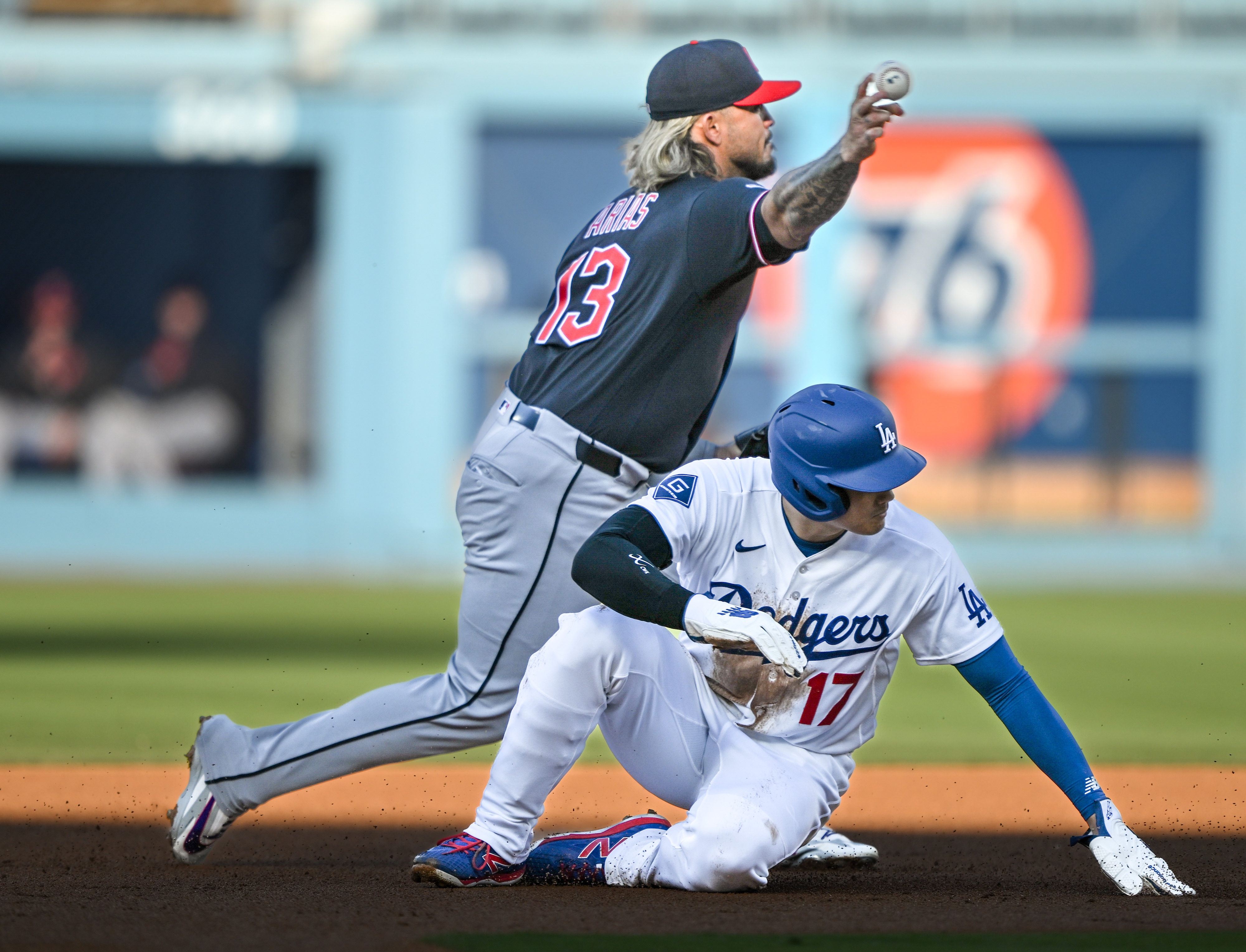 Cleveland Guardians shortstop Gabriel Arias throws to first base to...