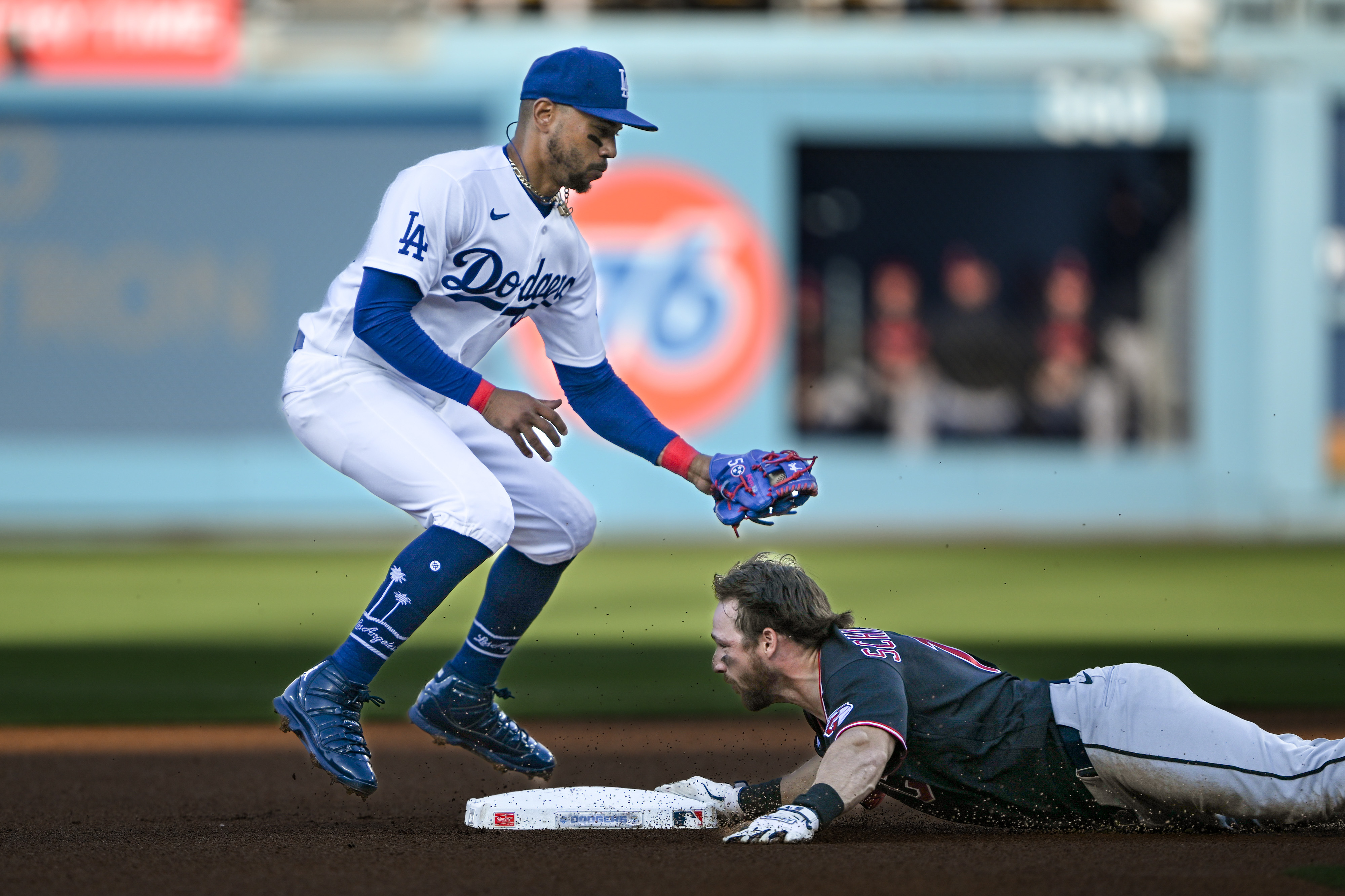 The Cleveland Guardians’ Daniel Schneemann slides into second base after...