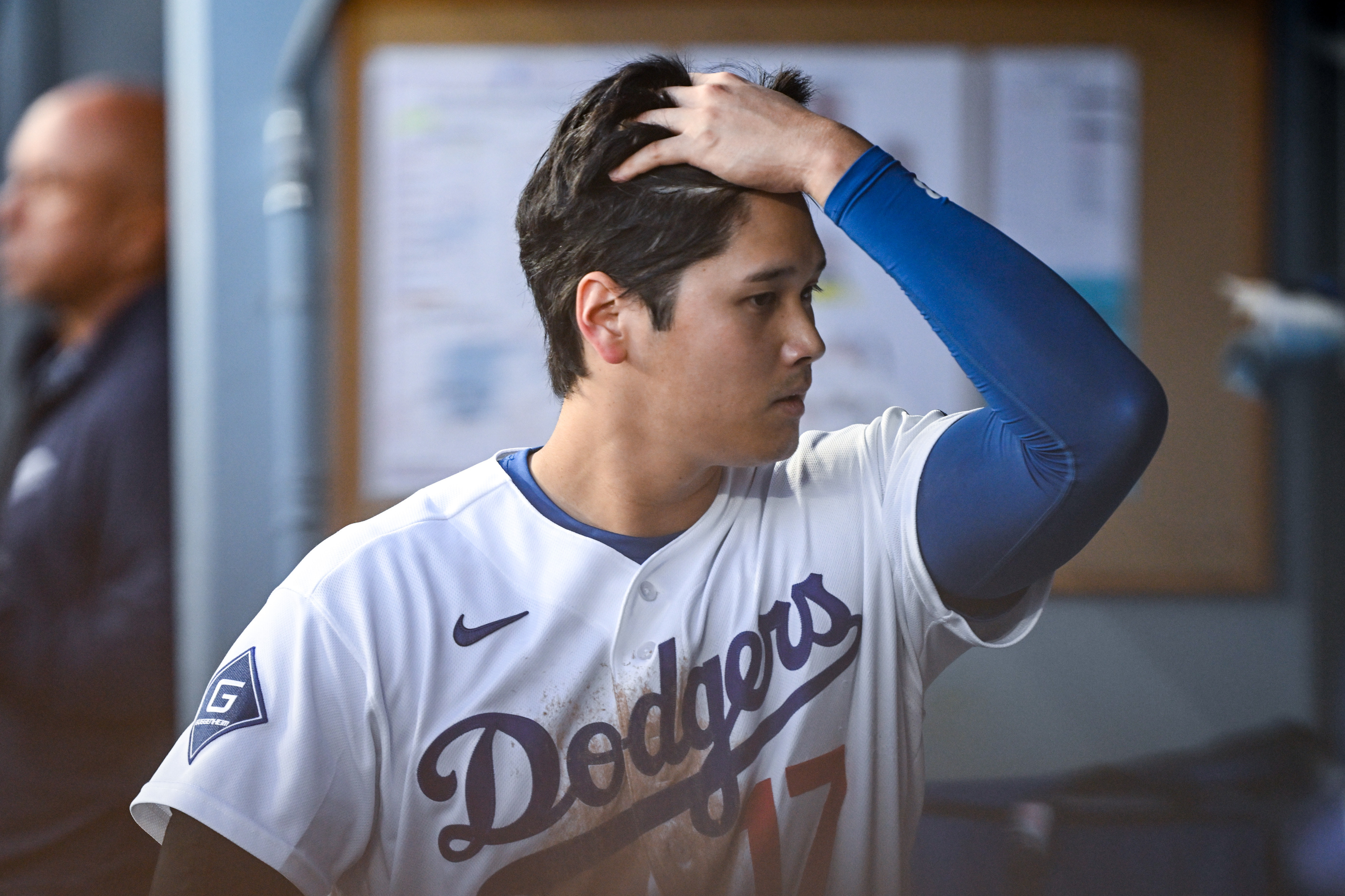 Dodgers star Shohei Ohtani returns to the dugout after striking...