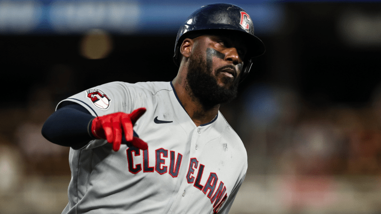 Franmil Reyes batting during MLB game with Cleveland Guardians, highlighting rumors of potential return to MLB after success in Japan
