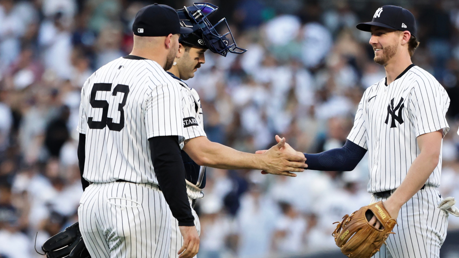 Austin Wells #28 and Ryan McMahon #19 of the New York Yankees celebrate a 3-2 win against the Baltimore Orioles at Yankee Stadium on September 28, 2025 in New York City. (Photo by Kent J. Edwards/Getty Images)