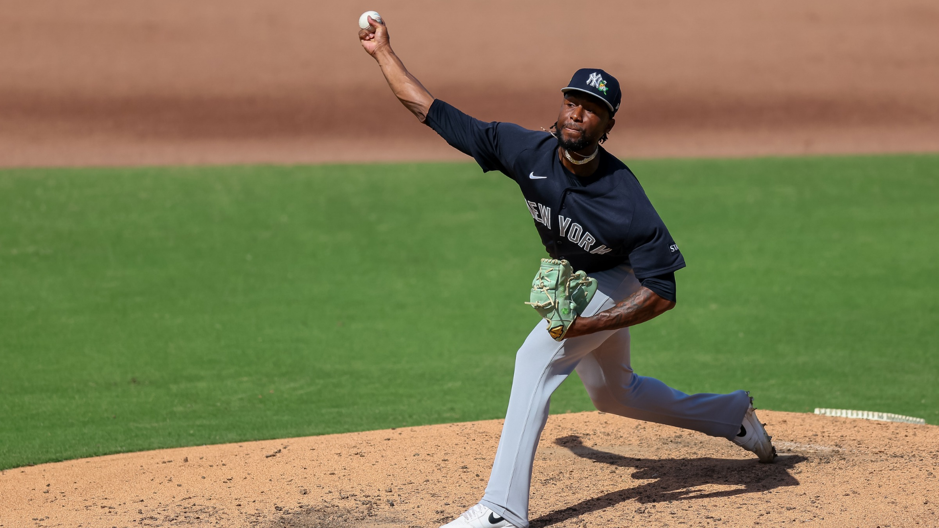 Angel Chivilli #57 of the New York Yankees delivers a pitch during a spring training game against the Philadelphia Phillies at BayCare Ballpark on March 1, 2026, in Clearwater, Florida, after being acquired by New York in a trade that sent first baseman TJ Rumfield to the Colorado Rockies.
