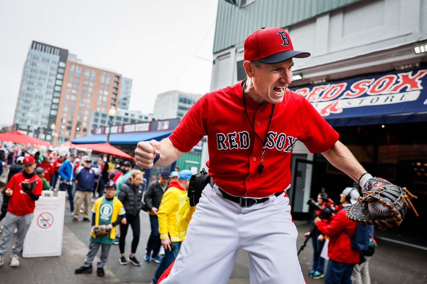 “Big League Brian,” a stilt walker, entertains fans along Lansdowne Street.