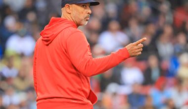 Red Sox manager Alex Cora signals to the bullpen as he comes out to remove Tyler Uberstine, who was making his major league debut, in the eighth inning.