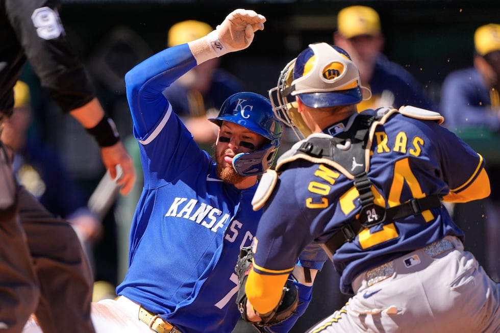 Kansas City Royals' Bobby Witt Jr. (7) is tagged out by Milwaukee Brewers catcher William...