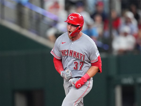 Reds beat Rangers 5-3 in their 1st road game with 3 homers, the last in the 9th