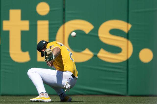 Athletics left fielder Tyler Soderstrom loses a ball hit by Houston Astros catcher Christian Vázquez in the sun during the third inning Saturday at Sutter Health Park in West Sacramento.