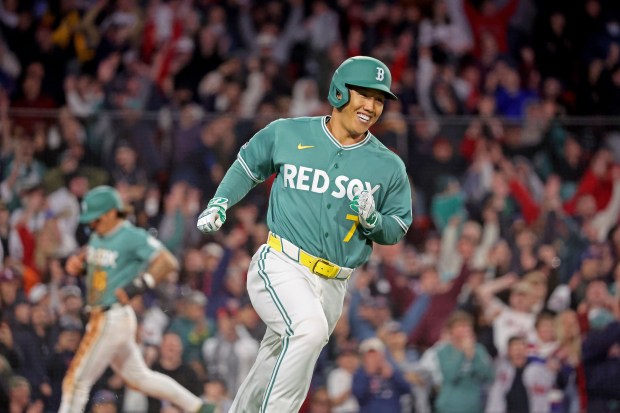 Boston Red Sox left fielder Masataka Yoshida smiles after his game-winning hit in the 10th inning. (Staff photo by Stuart Cahill/Boston Herald)