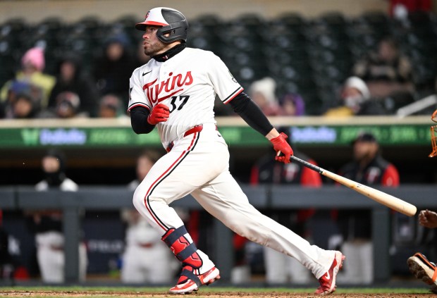 Victor Caratini #37 of the Minnesota Twins hits an RBI single against the Detroit Tigers during the eighth inning of the game at Target Field on April 6, 2026 in Minneapolis, Minnesota. (Photo by Stephen Maturen/Getty Images)