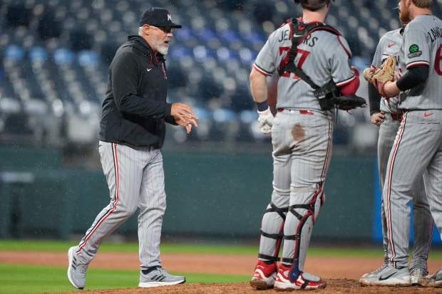 Minnesota Twins manager Derek Shelton walks to the mound to make a pitching change