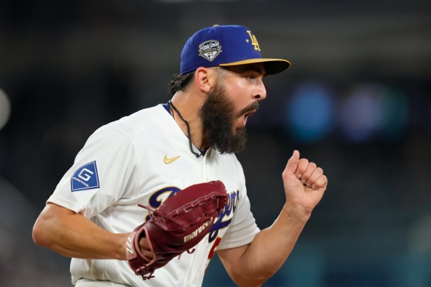 Los Angeles Dodgers relief pitcher Alex Vesia celebrates after forcing Arizona Diamondbacks' Carlos Santana out at first during the seventh inning of a baseball game Saturday, March 28, 2026, in Los Angeles. (AP Photo/Mark J. Terrill)