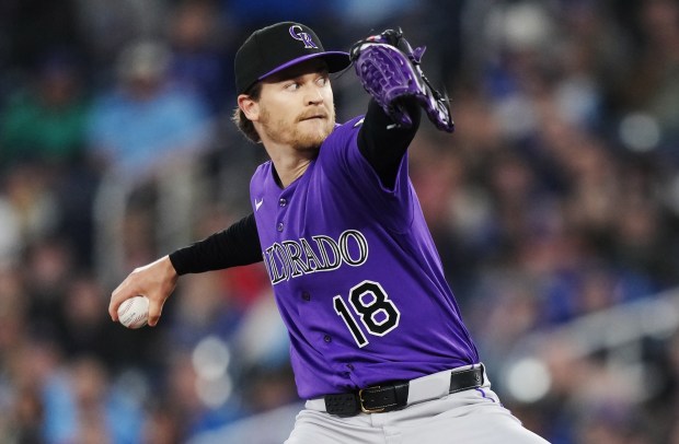 Colorado Rockies pitcher Ryan Feltner (18) works against the Toronto Blue Jays during first inning MLB baseball action in Toronto on Tuesday, March 31, 2026. (Nathan Denette/The Canadian Press via AP)