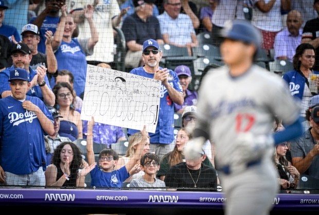 Shohei Ohtani (17) of the Los Angeles Dodgers celebrates hitting a solo homerun off of Austin Gomber (26) of the Colorado Rockies as fans erupt during the second inning at Coors Field in Denver on Tuesday, Aug. 19, 2025. (Photo by AAron Ontiveroz/The Denver Post)
