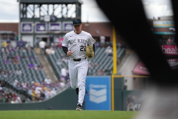 Mickey Moniak, left fielder for the Colorado Rockies, jogs back to the dugout at Coors Field during Thursdays game against the San Diego Padres in Denver on Thursday, April 23, 2026. (Photo by Harmon Dobson/The Denver Post)
