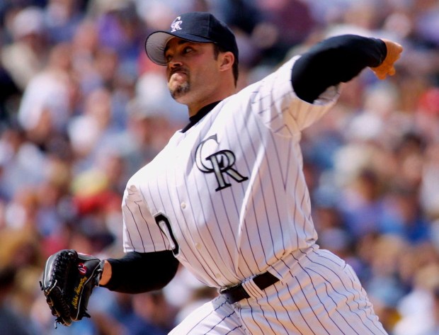 Colorado Rockies starter Mike Hampton delivers a pitch to St. Louis Cardinals' Jim Edmonds in the first inning in Denver, Monday, April 2, 2001. The start was the first for Hampton in a Rockies uniform since signing in the offseason with Colorado. The Rockies beat the Cardinals 8-0. (AP Photo/Jack Dempsey)