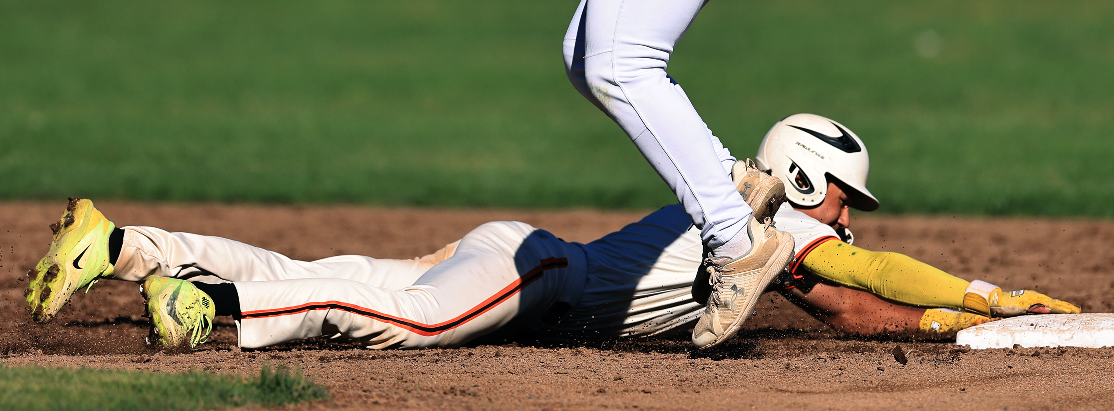 Mateo Fitzgerald of Santa Rosa slides back safely to second...