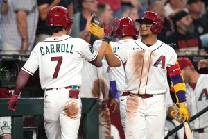 Arizona Diamondbacks Gabriel Moreno (14) congratulates Corbin Carroll (7) on his 3-run home run against the Detroit Tigers at Chase Field on March 30, 2026. © Joe Rondone/The Republic / USA TODAY NETWORK via Imagn Images