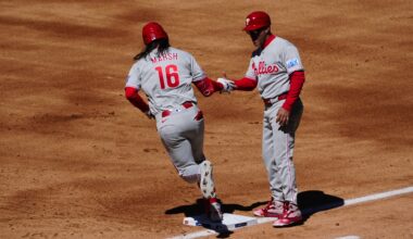Apr 3, 2026; Denver, Colorado, USA; Philadelphia Phillies center fielder Brandon Marsh (16) celebrates his three run home run with first base coach Paco Figueroa (38) in the first inning against the Philadelphia Phillies at Coors Field.