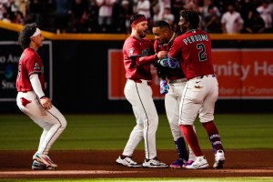 Apr 5, 2026; Phoenix, Arizona, USA; Arizona Diamondbacks second baseman Ketel Marte (4) celebrates with shortstop Geraldo Perdomo (2) two run home run against the Atlanta Braves during the tenth inning at Chase Field. Mandatory Credit: Arianna Grainey-Imagn Images