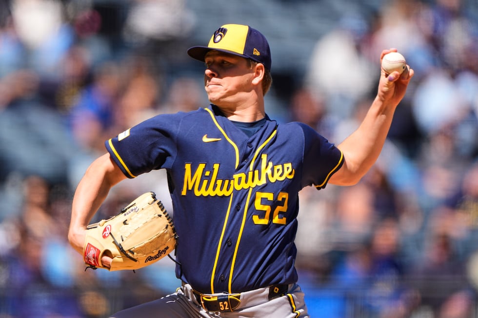 Milwaukee Brewers starting pitcher Kyle Harrison throws during the first inning of a baseball...