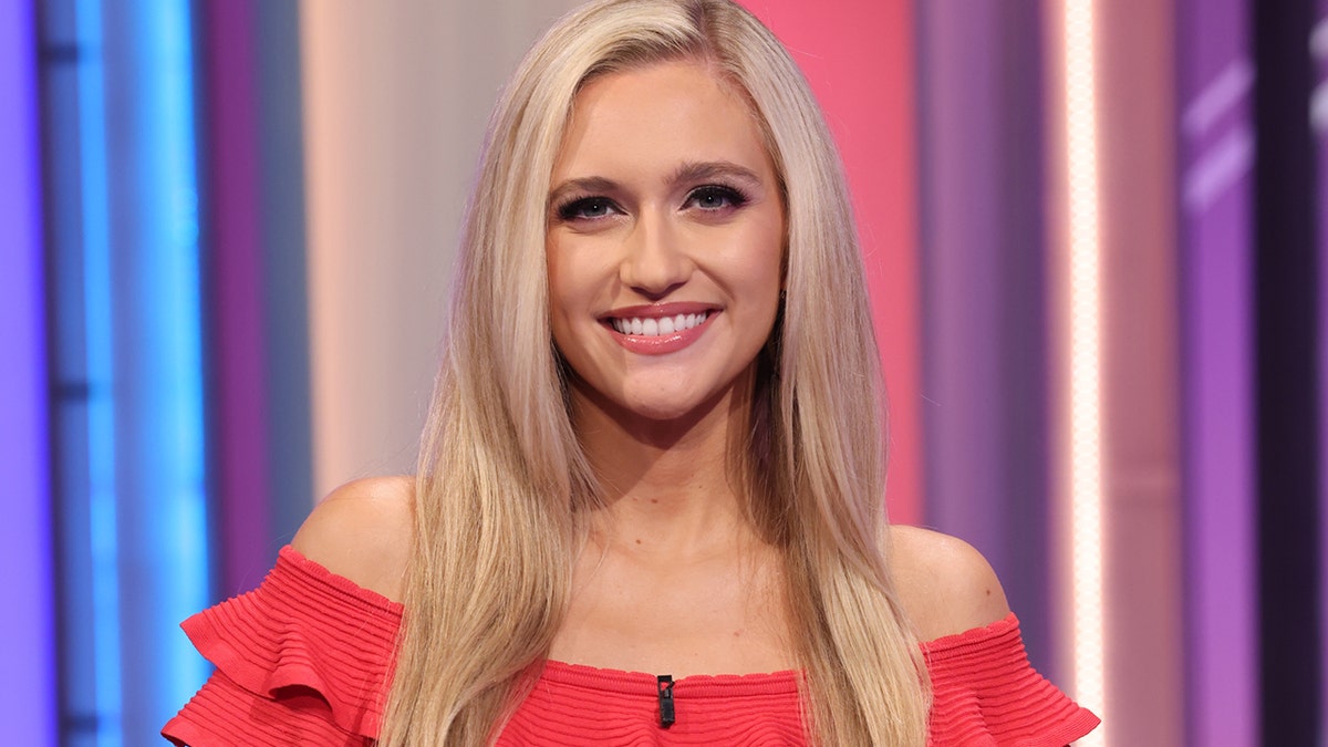 Maggie Sajak smiling and seated indoors