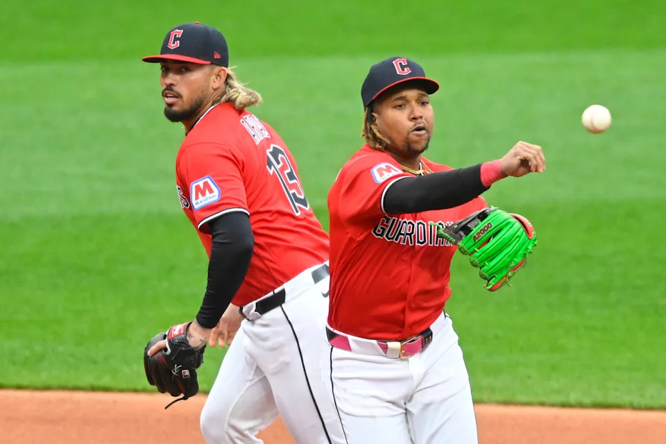 Cleveland Guardians third baseman Jose Ramirez throws to first base as shortstop Gabriel Arias looks on against the Chicago Cubs on April 5, 2026, in Cleveland.