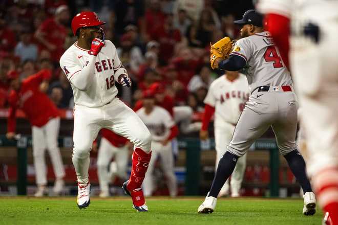A fight breaks out during the fifth inning of a baseball game between the Los Angeles Angels and the Atlanta Braves, Tuesday, April 7, 2026, in Anaheim, Calif.